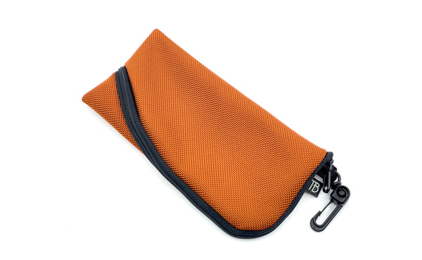 A Small Ghost Whale Pouch in Burnt Orange.